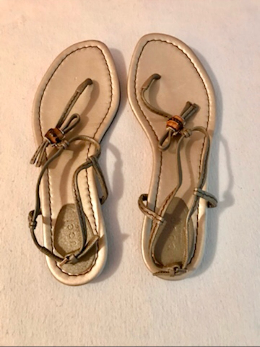 Gucci Gold T-Strap Leather Sandals with Knot Accent
